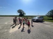 Students are shown the squad car during a safety talk