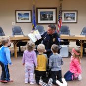 Chief Wilhelm reads to youth at the Dodgeville Public Library